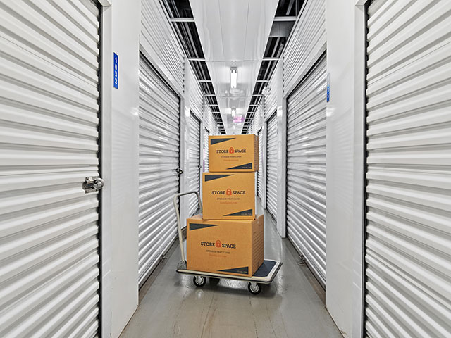 moving boxes in a hallway at Store Space at 6301 S 650 E in Zionsville, IN