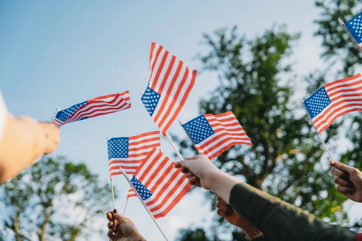 Hands holding small flags Hands holding small flags